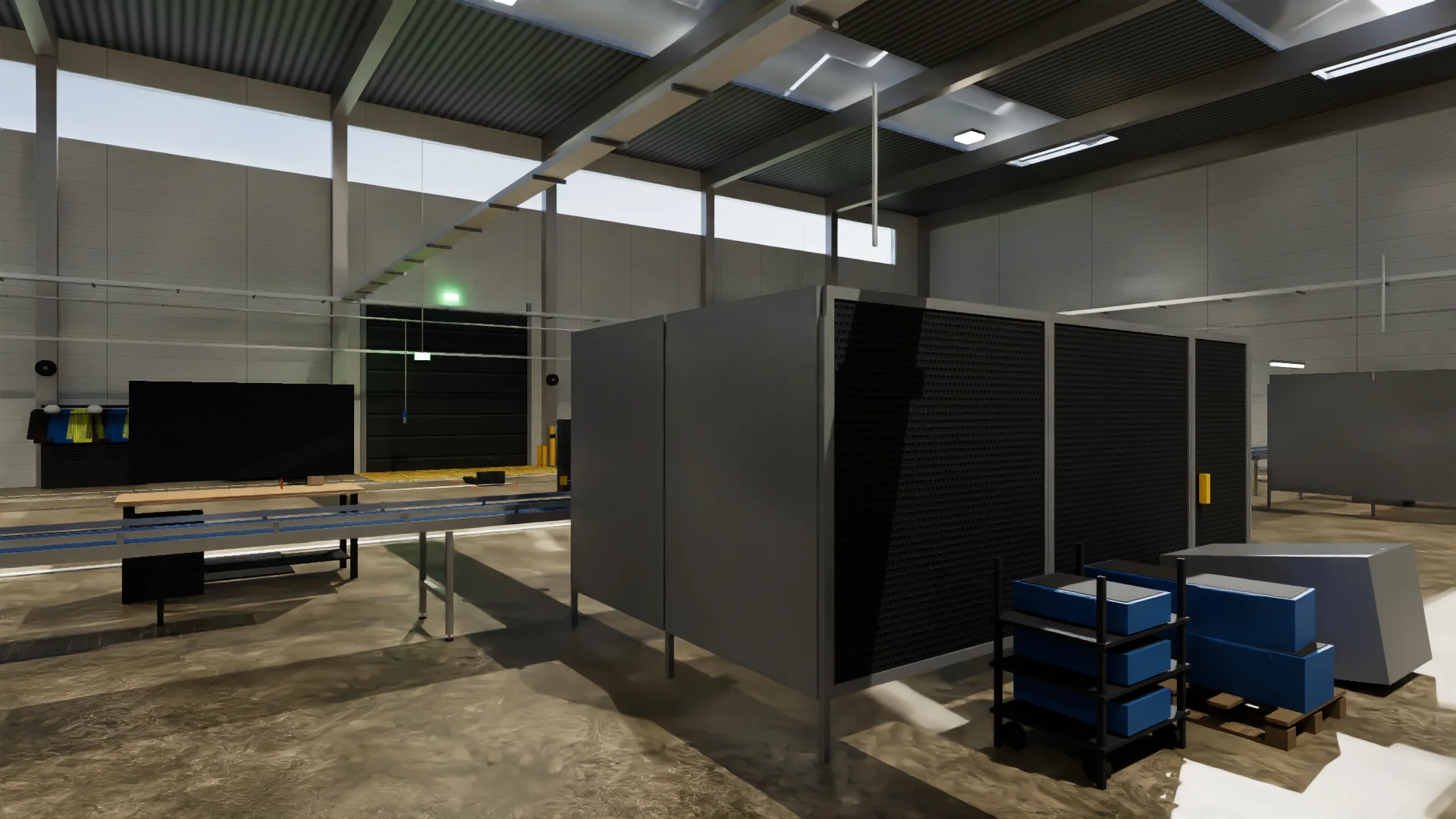 A fenced cell on the shop floor, with crates on trolleys beside it.