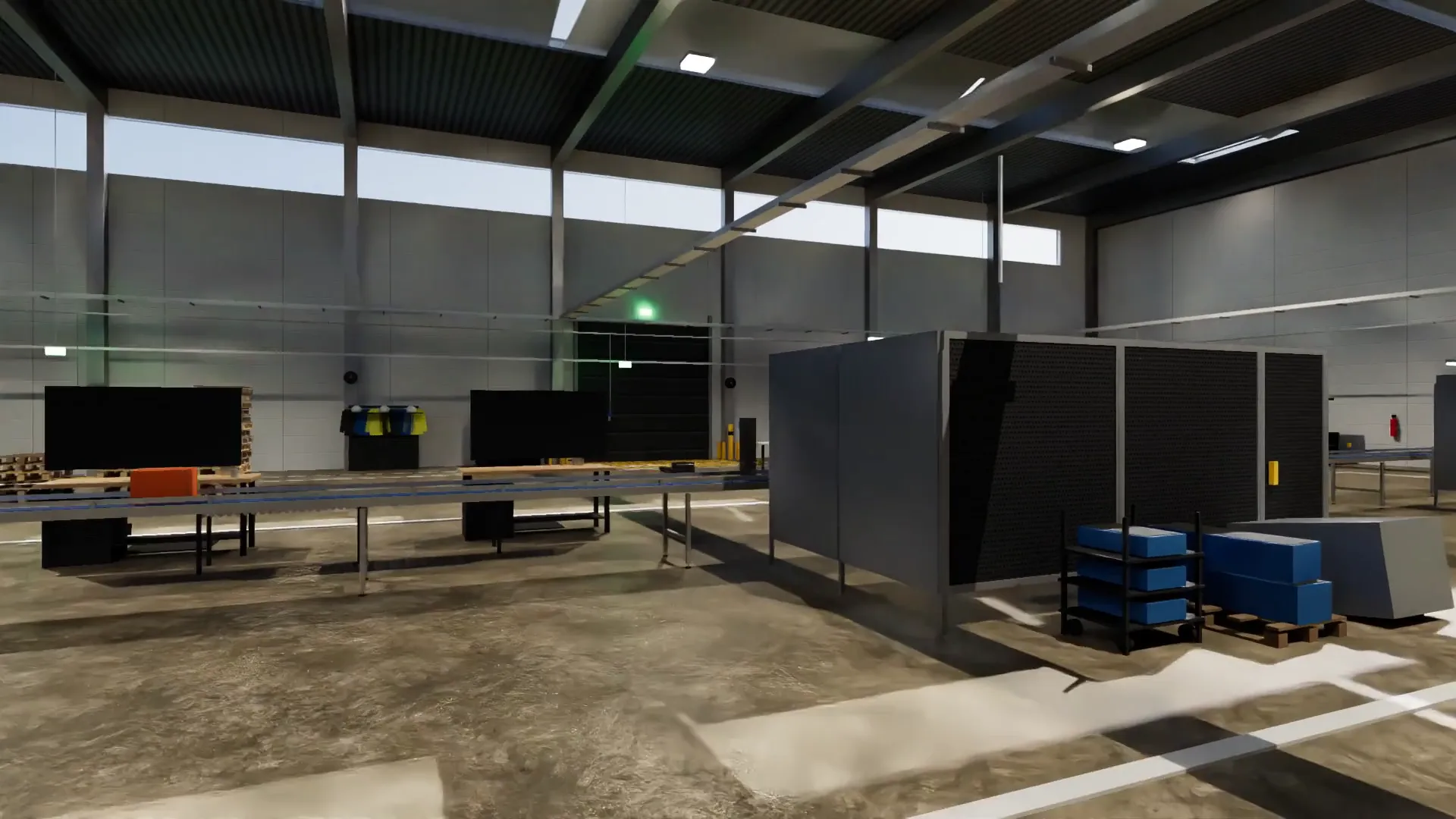 The hall across its width: conveyor, safety fencing, overhead door.